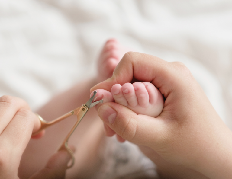 parent-trimming-baby-toenails-small-scissors-close-up.jpg